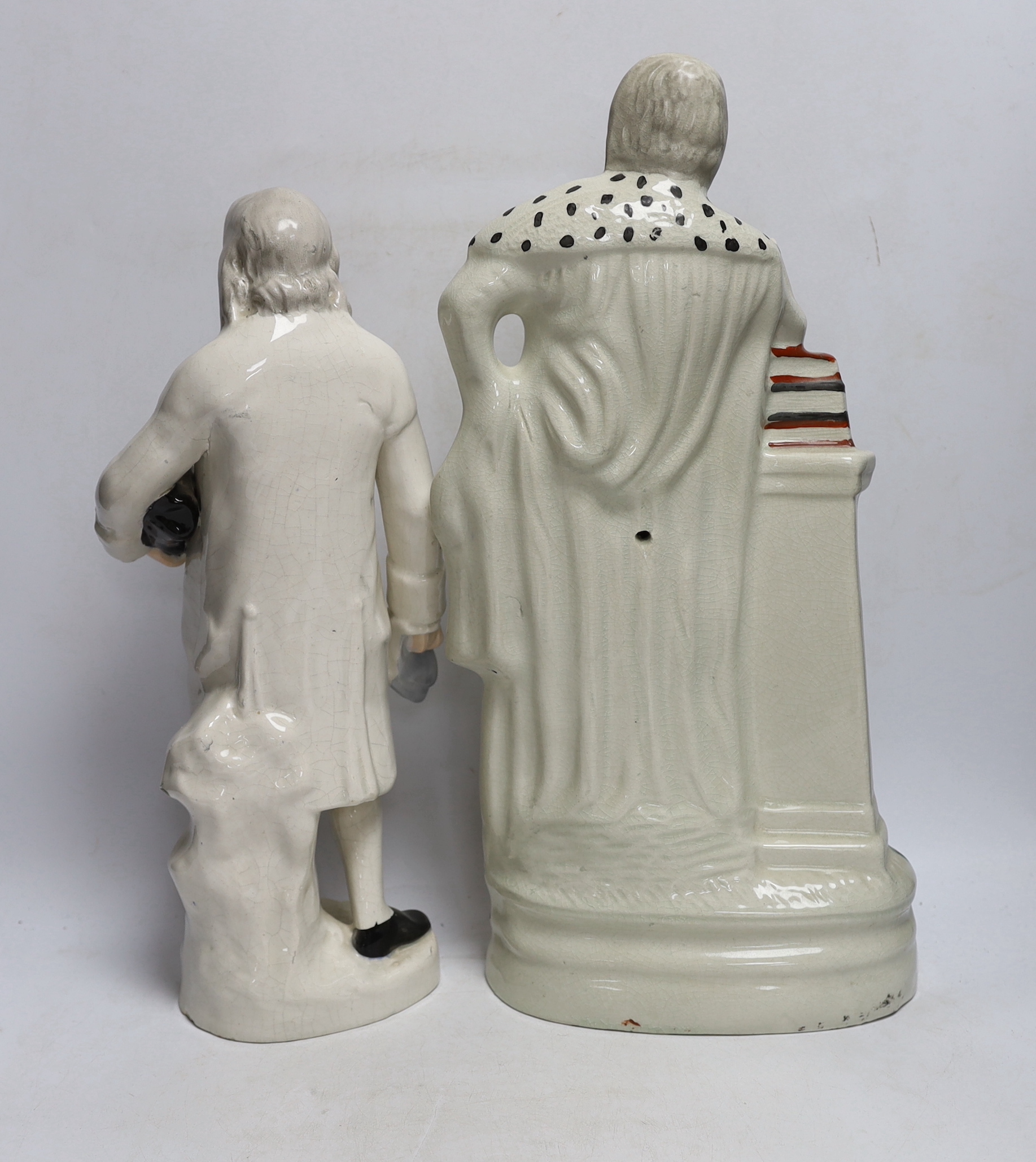 A Staffordshire pottery figure of Benjamin Franklin, modelled holding the Bill of Rights and a Staffordshire style pottery figure of William Shakespeare, tallest 46cm